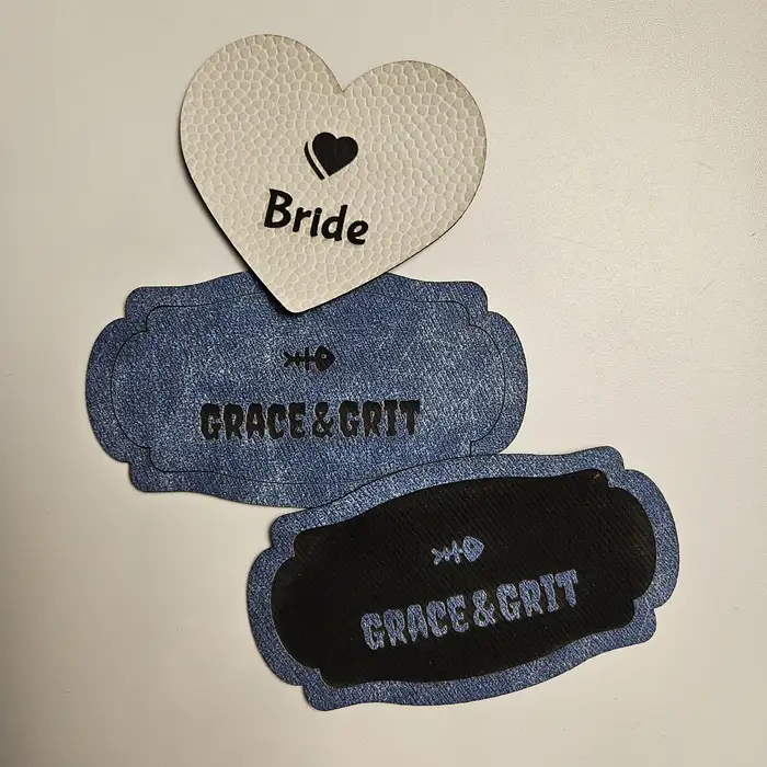 Laser-cut leather hat patch with Grace and Grit engraving and capsule shape